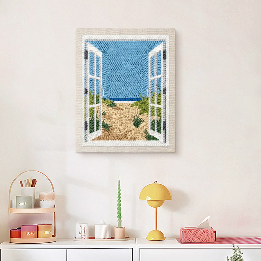 Finished Beach Window punch needle canvas on a wall
