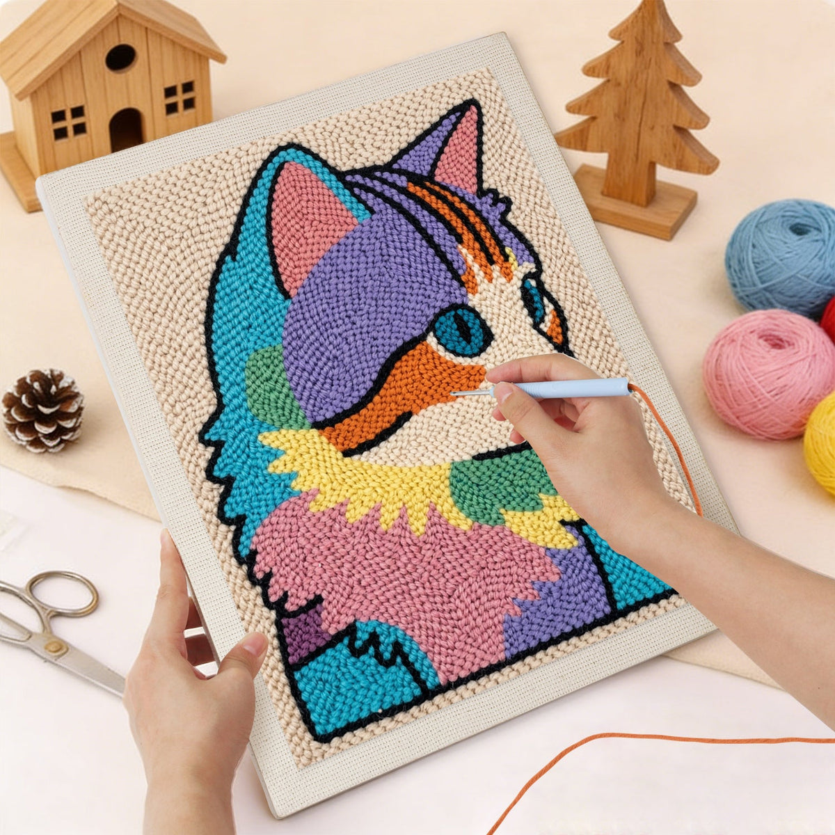 Punching the Rainbow Patchwork Cat design with the punch needle