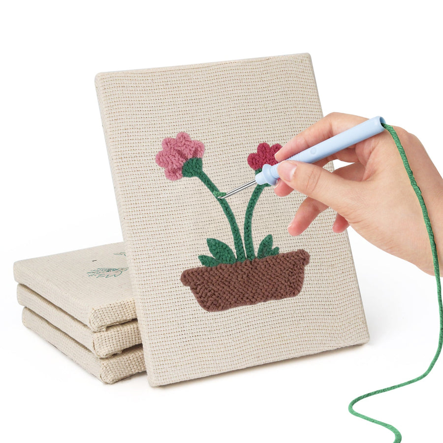 Hand punching one of the Windowsill Blooms mini canvases