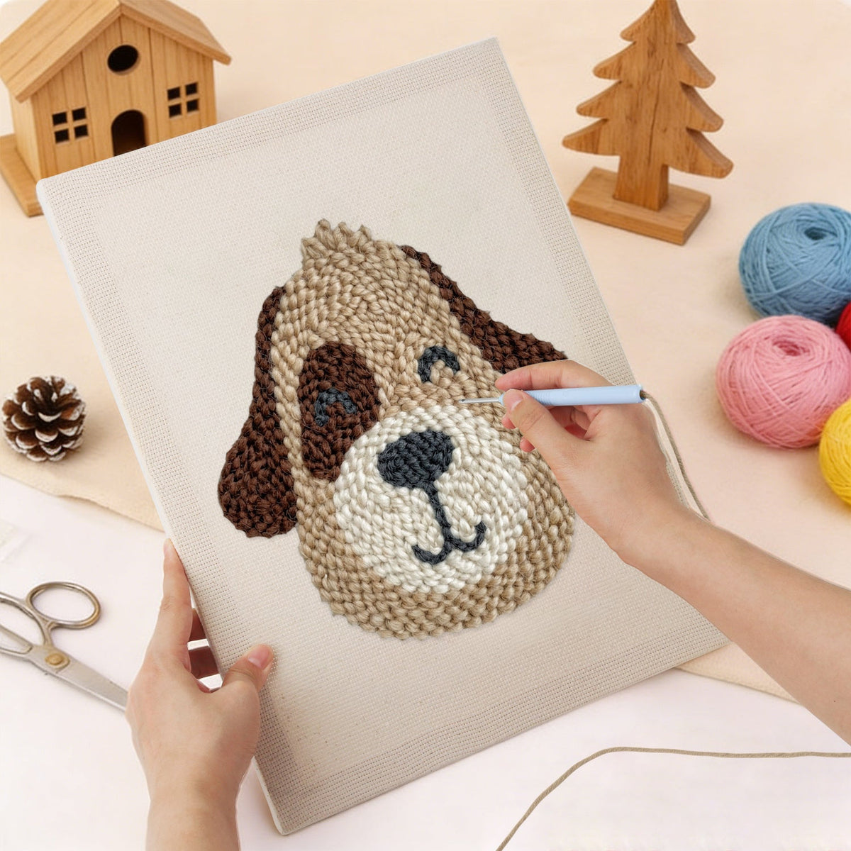 Punching the Winking Puppy design with the punch needle