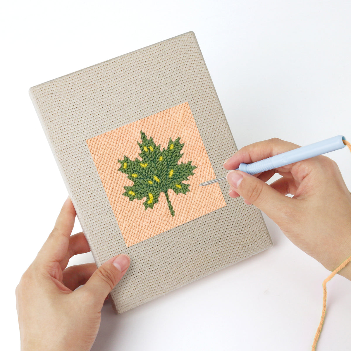 Punching a Acorn and Mushroom mini canvas with the punch needle
