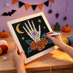 Punching the All-Seeing Bone Hand design with the punch needle
