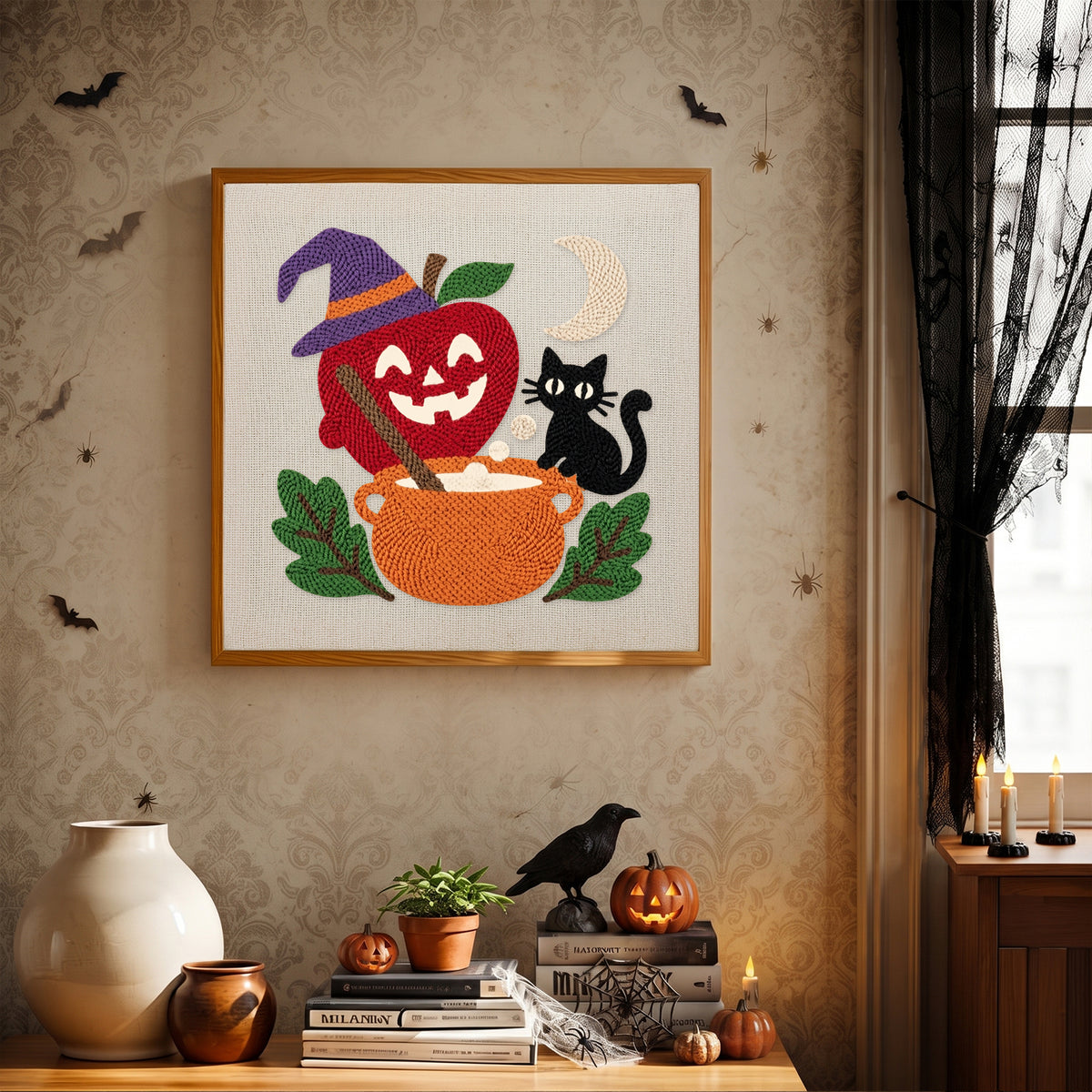Finished Apple Cauldron Cat punch needle canvas on a wall