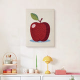 Finished Apple on Blue punch needle canvas on a wall
