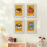 The four Apple Salad Jar mini canvases on a wall above a shelf