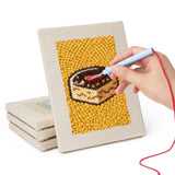 Hand punching one of the Apple Salad Jar mini canvases