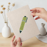 Hand holding a finished Art Class Palette mini canvas