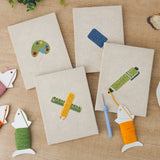 The four finished Art Class Palette mini canvases laid out on a table