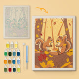 Autumn Squirrels canvas before and after punching, with the threads and tools