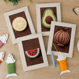 The four finished Avocado Watermelon mini canvases laid out on a table