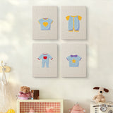 The four Baby Blue Outfits mini canvases on a wall above a shelf