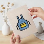 Hand holding a finished Backyard Burger Cook mini canvas