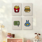 The four Backyard Burger Cook mini canvases on a wall above a shelf