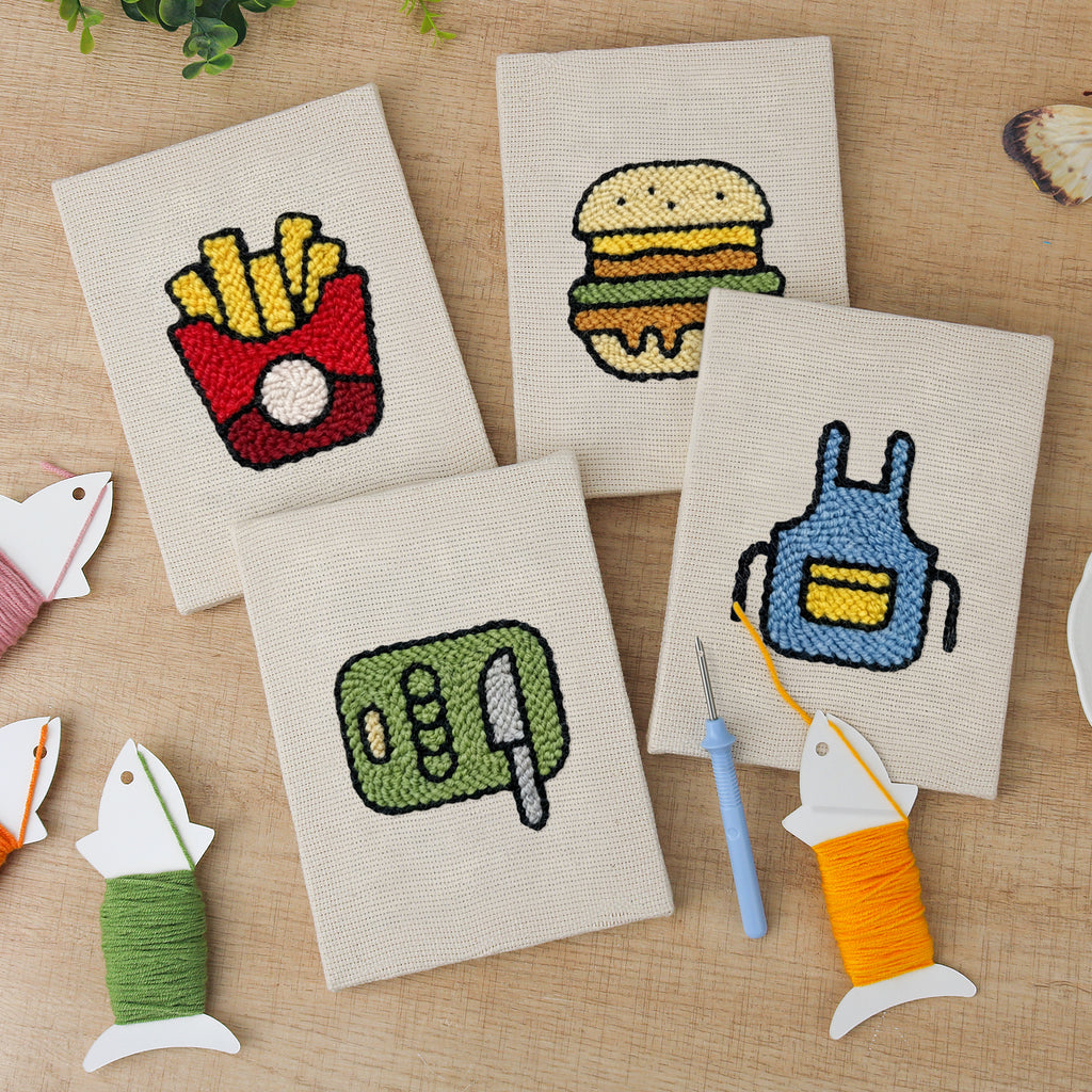 The four finished Backyard Burger Cook mini canvases laid out on a table