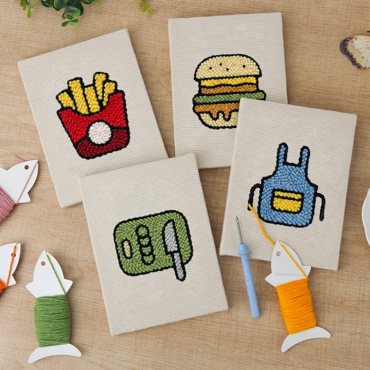 The four finished Backyard Burger Cook mini canvases laid out on a table