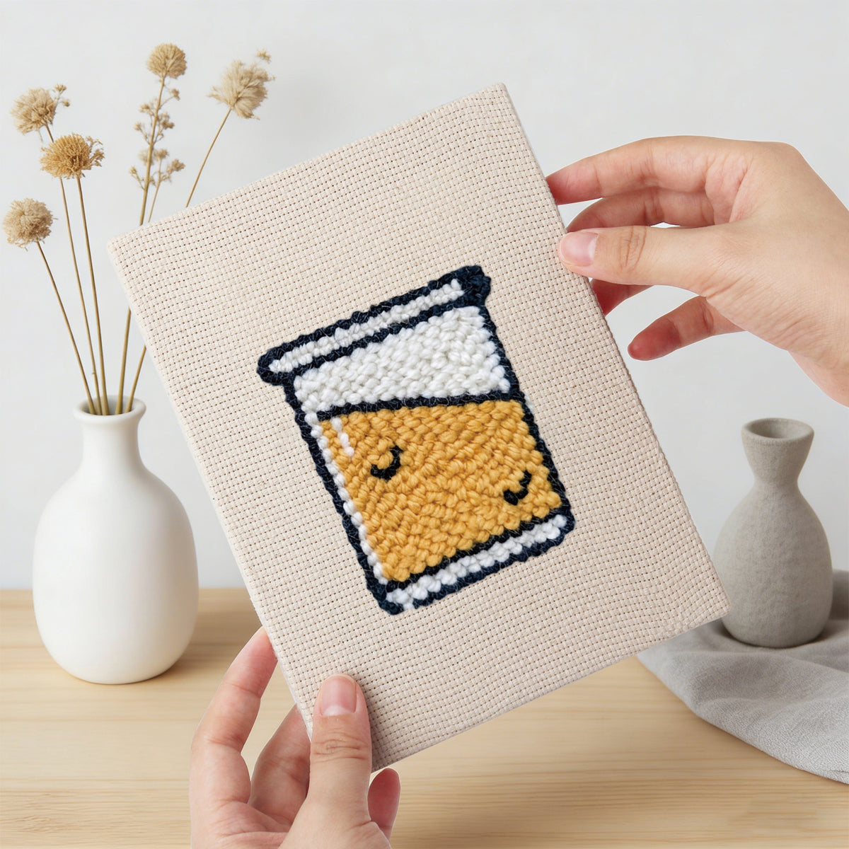 Hand holding a finished Bakery Treats mini canvas