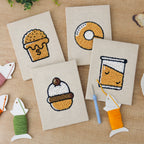 The four finished Bakery Treats mini canvases laid out on a table