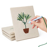 Hand punching one of the Bamboo Palm Pots mini canvases