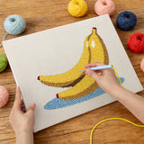 Punching the Banana Bunch design with the punch needle