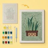 Basket Snake Plant canvas before and after punching, with the threads and tools