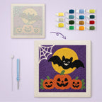 Bat and Three Pumpkins canvas before and after punching, with the threads and tools
