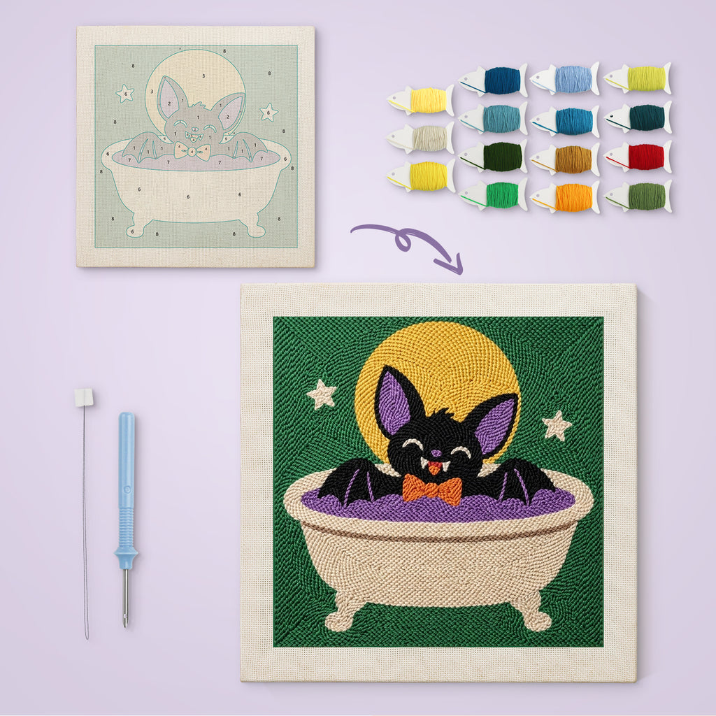 Bat Cat Bath canvas before and after punching, with the threads and tools