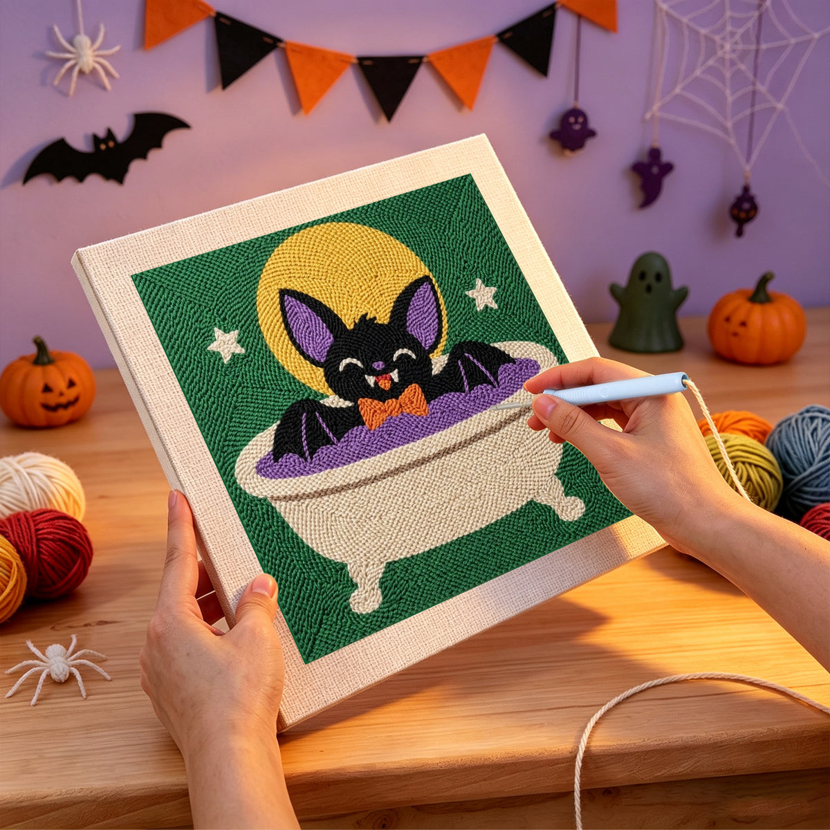 Punching the Bat Cat Bath design with the punch needle