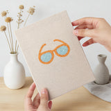 Hand holding a finished Beach Day Essentials mini canvas