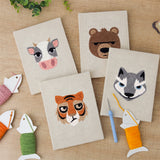The four finished Bear and Tiger mini canvases laid out on a table