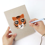 Punching a Bear and Tiger mini canvas with the punch needle
