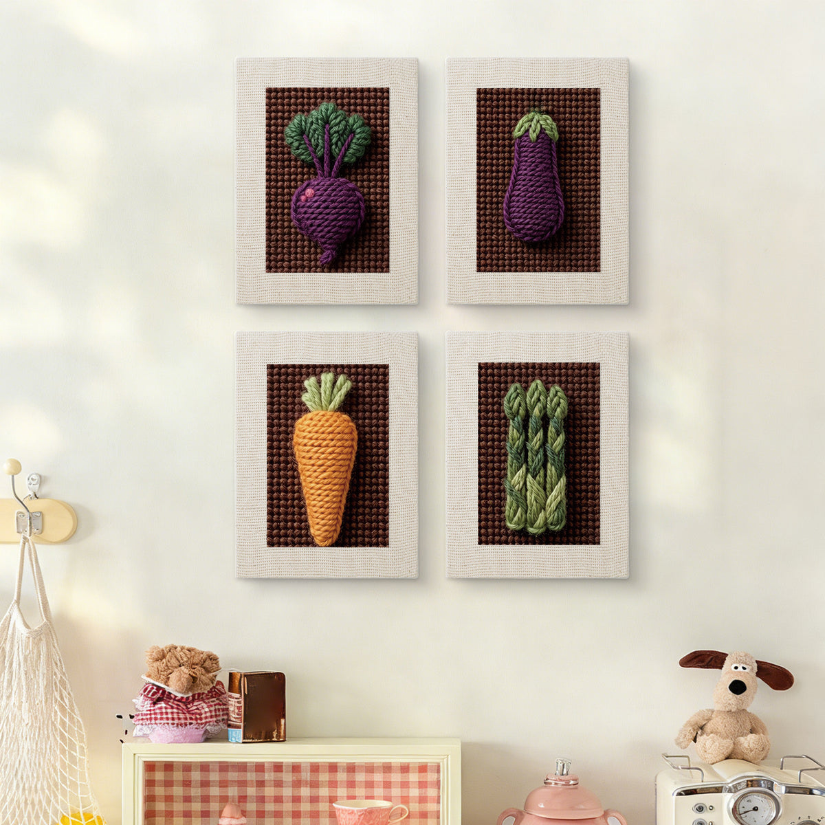 The four Beet Carrot Eggplant mini canvases on a wall above a shelf