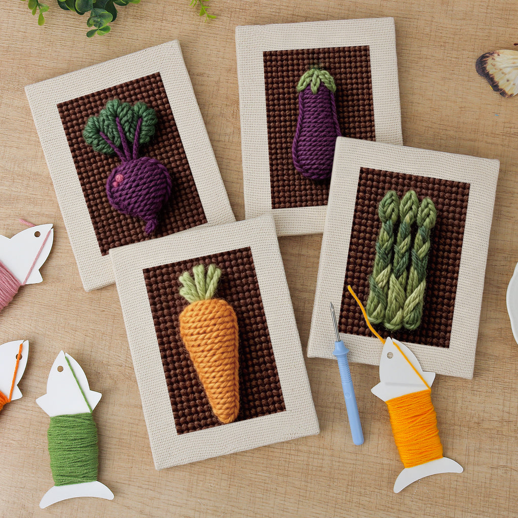 The four finished Beet Carrot Eggplant mini canvases laid out on a table