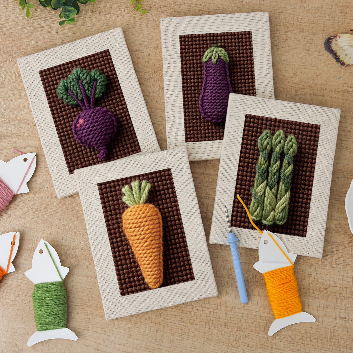 The four finished Beet Carrot Eggplant mini canvases laid out on a table