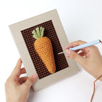 Punching a Beet Carrot Eggplant mini canvas with the punch needle
