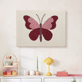 Finished Berry Butterfly punch needle canvas on a wall