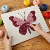 Punching the Berry Butterfly design with the punch needle