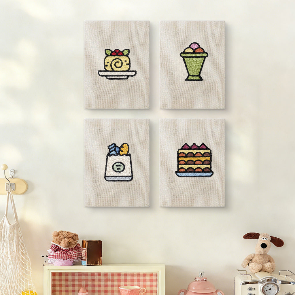 The four Berry Roll Cake mini canvases on a wall above a shelf