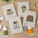 The four finished Berry Roll Cake mini canvases laid out on a table