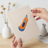 Hand holding a finished Binder Clip Tools mini canvas