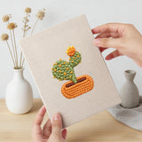 Hand holding a finished Blooming Cactus Shelf mini canvas