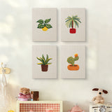 The four Blooming Cactus Shelf mini canvases on a wall above a shelf