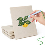 Hand punching one of the Blooming Cactus Shelf mini canvases