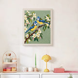 Finished Blossom Songbirds punch needle canvas on a wall