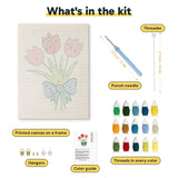 What is in the Blue Bow Tulips kit: printed canvas, punch needle, threader, threads, color guide and hangers