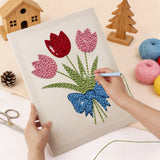 Punching the Blue Bow Tulips design with the punch needle
