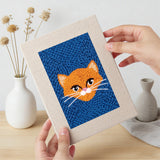 Hand holding a finished Blue Cat Portraits mini canvas