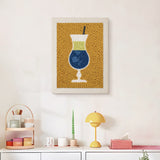 Finished Blue Cocktail Hour punch needle canvas on a wall