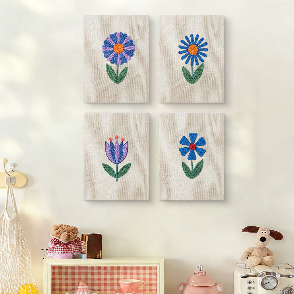 The four Blue Garden Blooms mini canvases on a wall above a shelf