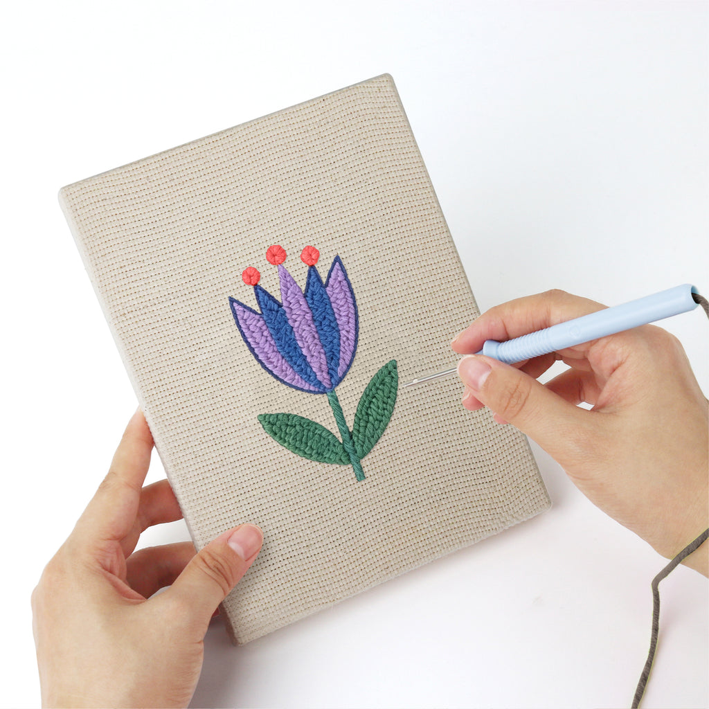 Punching a Blue Garden Blooms mini canvas with the punch needle