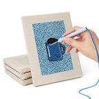 Hand punching one of the Blue Mug Morning mini canvases